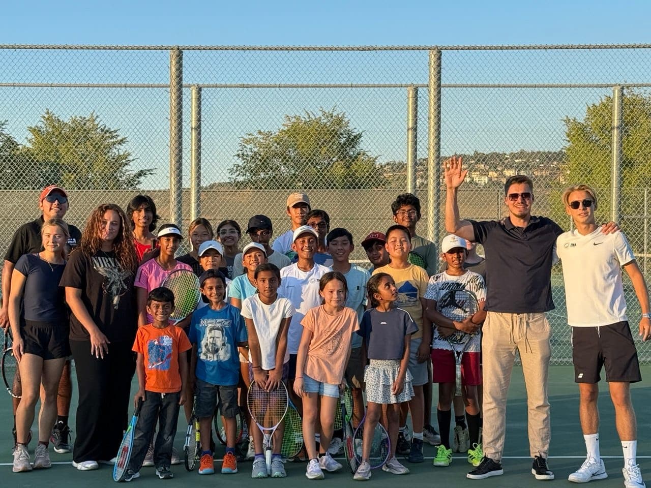TNA Pro Academy coaches with their junior players after a session in California