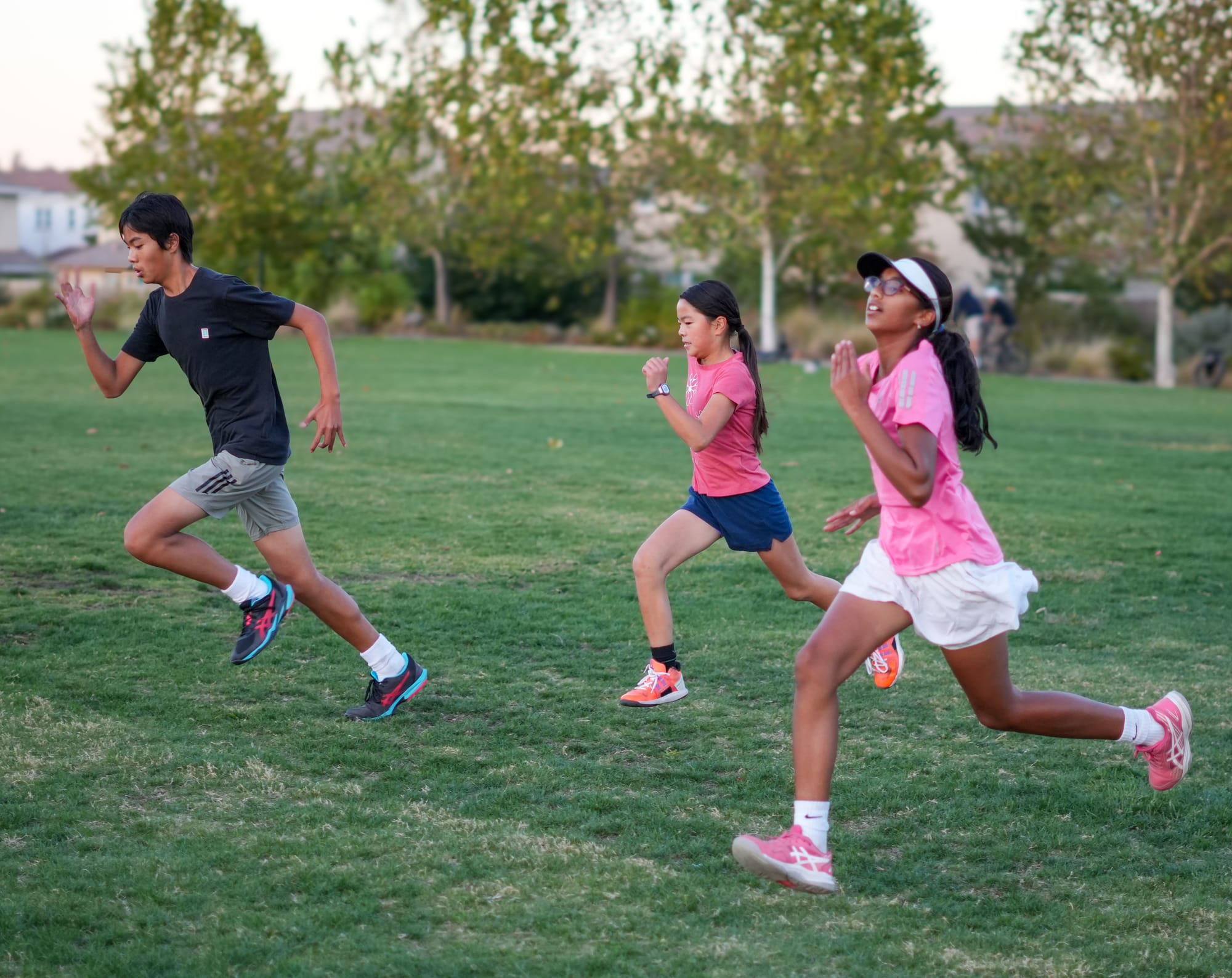 Junior players sprinting on grass during a TNA Pro Academy fitness session